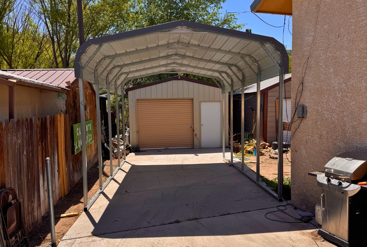 12'x20'x8' charcoal gray roof with open sides for one vehicle only, front view.