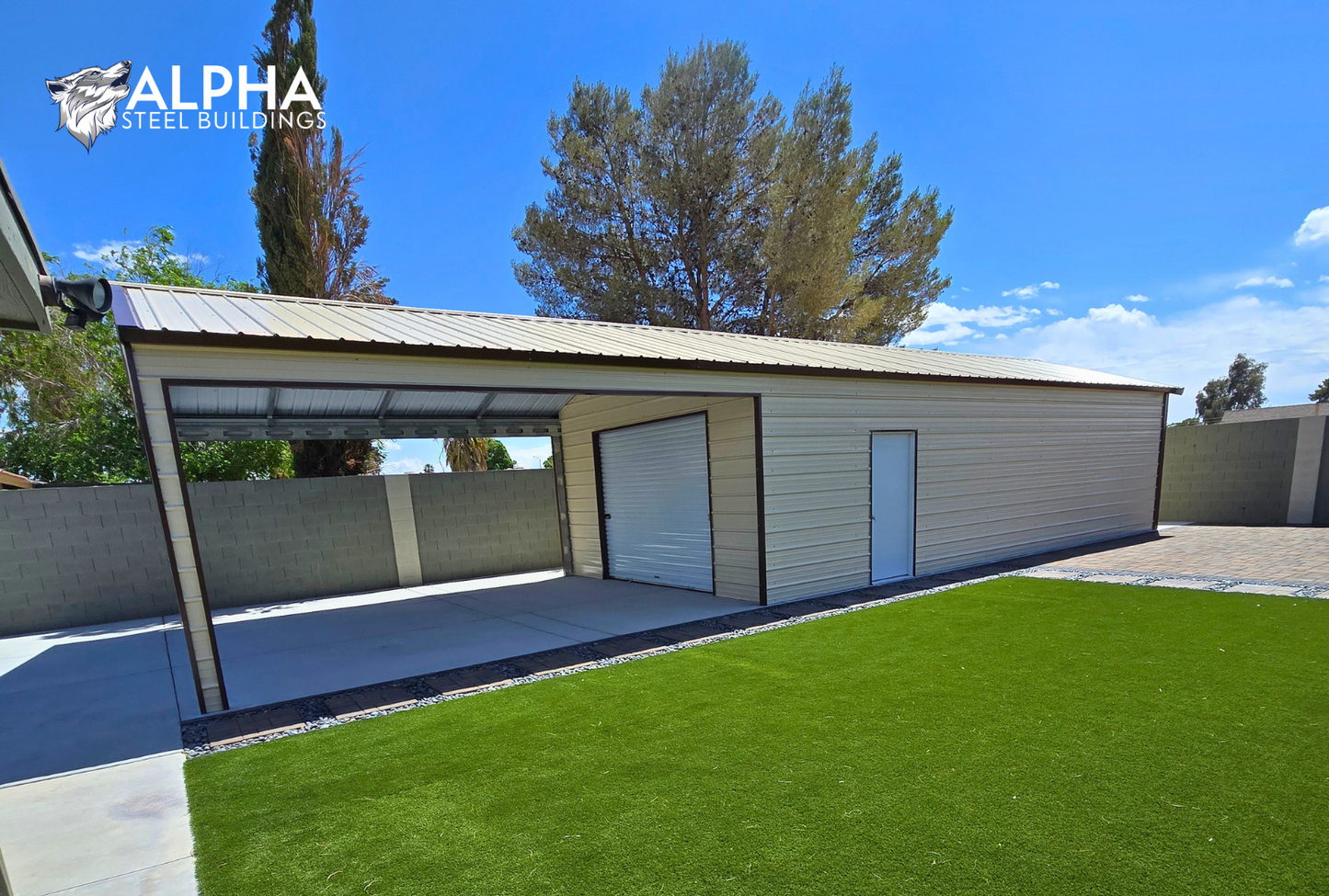 Wide angled view of 18x55x9 A-frame steel garage from the right side, showing full length of the building, vertical roof, and open front-side sections.