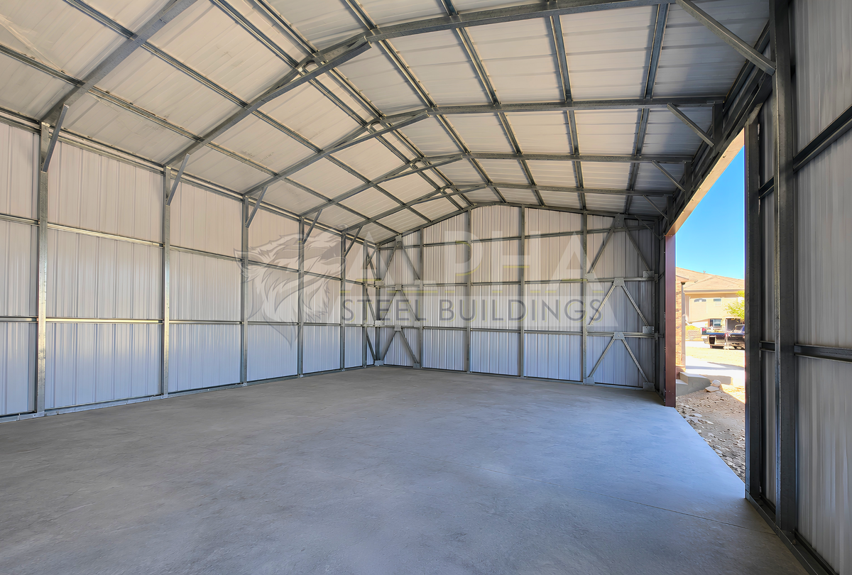 Interior view of 22x60x12 A-frame utility building showing vertical roof panels, enclosed back wall, and structural framing with bracing.