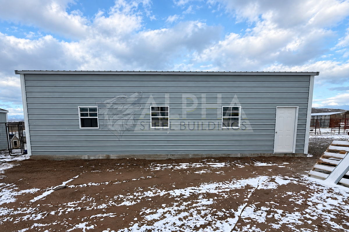 30'x40'x11' A-frame vertical roof steel shop side view with windows and walk-in door
