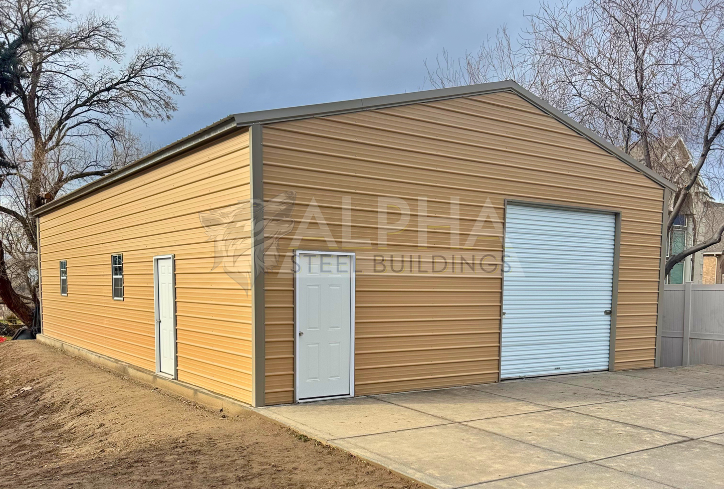 Close-up front left angle of 30x50 A-frame steel building highlighting vertical roof panels, windows, and entry doors
