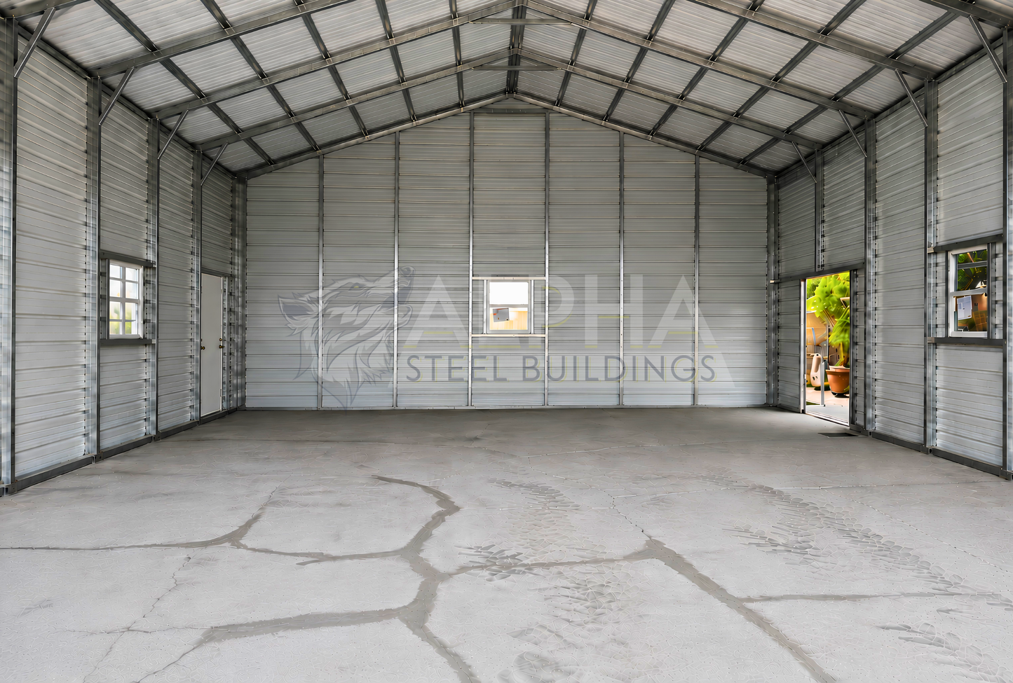 Interior of a 30'x50'x12' continuous roof barn style steel building featuring a spacious open floor plan, vertical roof, enclosed walls, walk-in door, and window.