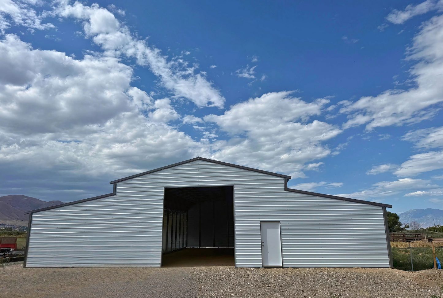 60'x60'x14' down to 12'-9' steel barn style with lean-tos, two panels under the eave, both sides closed, all ends closed, with 12' x 15' wash bay, (1) 12' x 13' frame out on the end, (1) 9' x 7' frame out on the end, (1) 14'2" x 12' wash bay frame out on the side, (4) 9'2" x 8' stall frame outs on the side of left lean-to, (2) 14'2" x 8' frame outs on the side of right lean-to, (1) 36" x 80" walk-in door, front view.