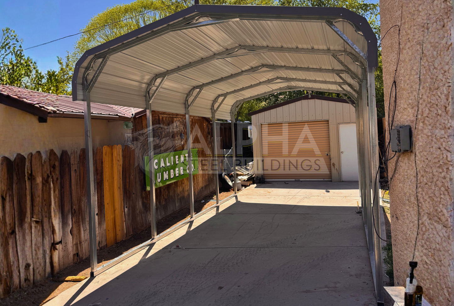 Front right angle view of a 12x20x8 regular style steel carport showing the horizontal roof, 14-gauge steel frame, and open sides and front end.