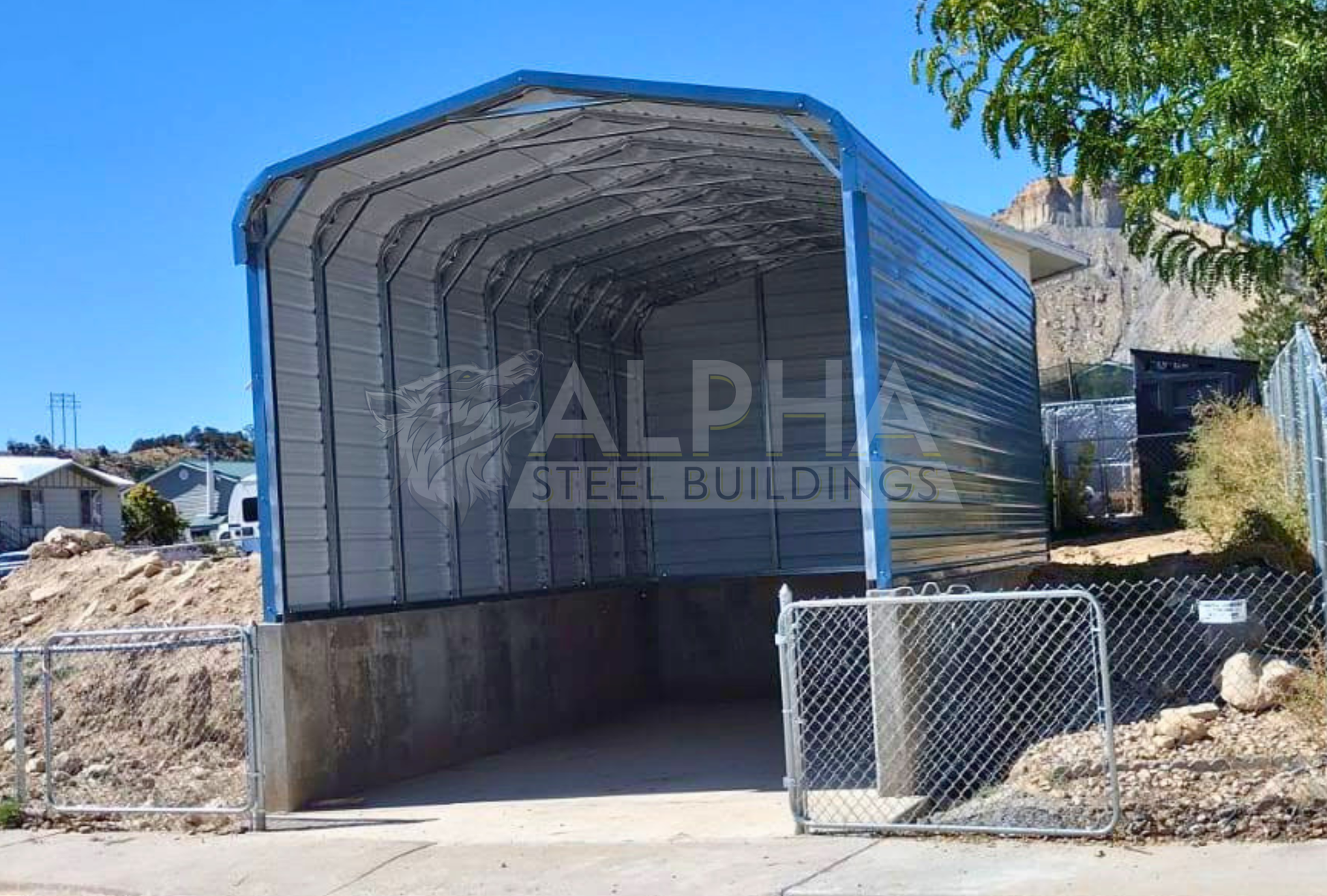Front wide view of 18'x25'x8' regular style horizontal rv cover - built on stem wall for extra height, closed on three sides.