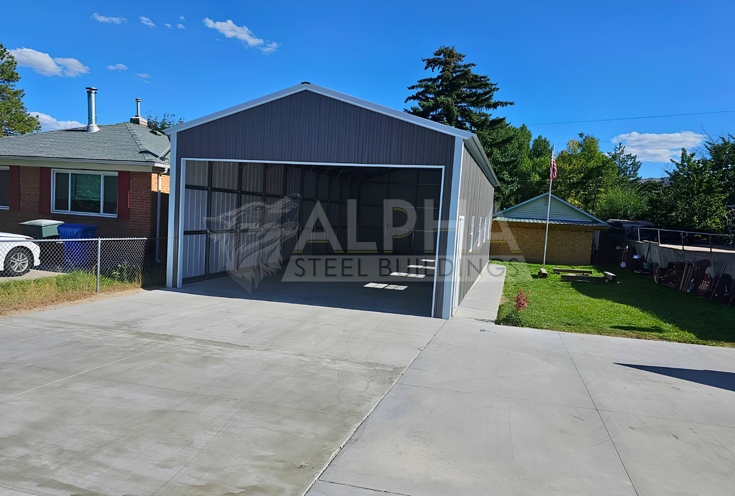 Front view of 22' x 50' x 12' steel garage featuring a 20' x 10' overhead door frame out, one 6' x 6' roll-up door on the back, four windows and one walk-in door.