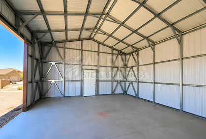 Interior view of 22x60x12 A-frame utility building showing steel framing, vertical wall panels, cross bracing, and walk-in door.