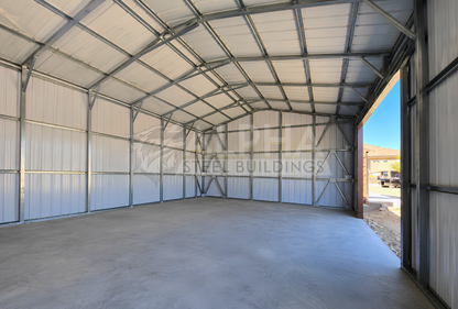 Interior view of 22x60x12 A-frame utility building showing vertical roof panels, enclosed back wall, and structural framing with bracing.