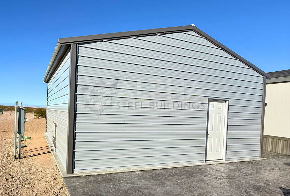 24'x25'x10' A-frame vertical roof steel garage rear right angle showing enclosed end wall and 36"x80" walk-in door.