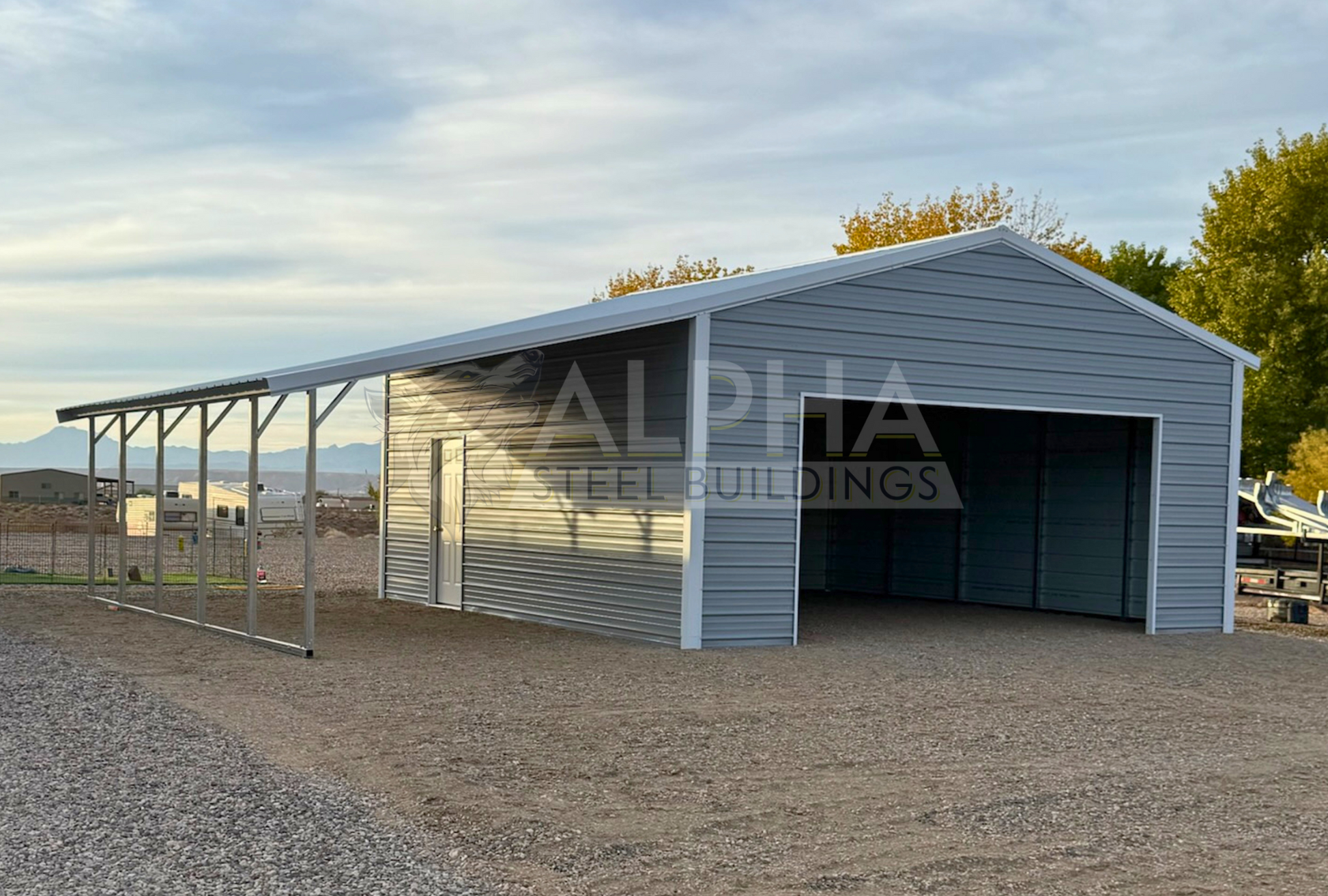 24'x25'x10' vertical roof steel garage with 12'x25' lean-to shown from the front-left angle with overhead door frame-out and walk-in door.