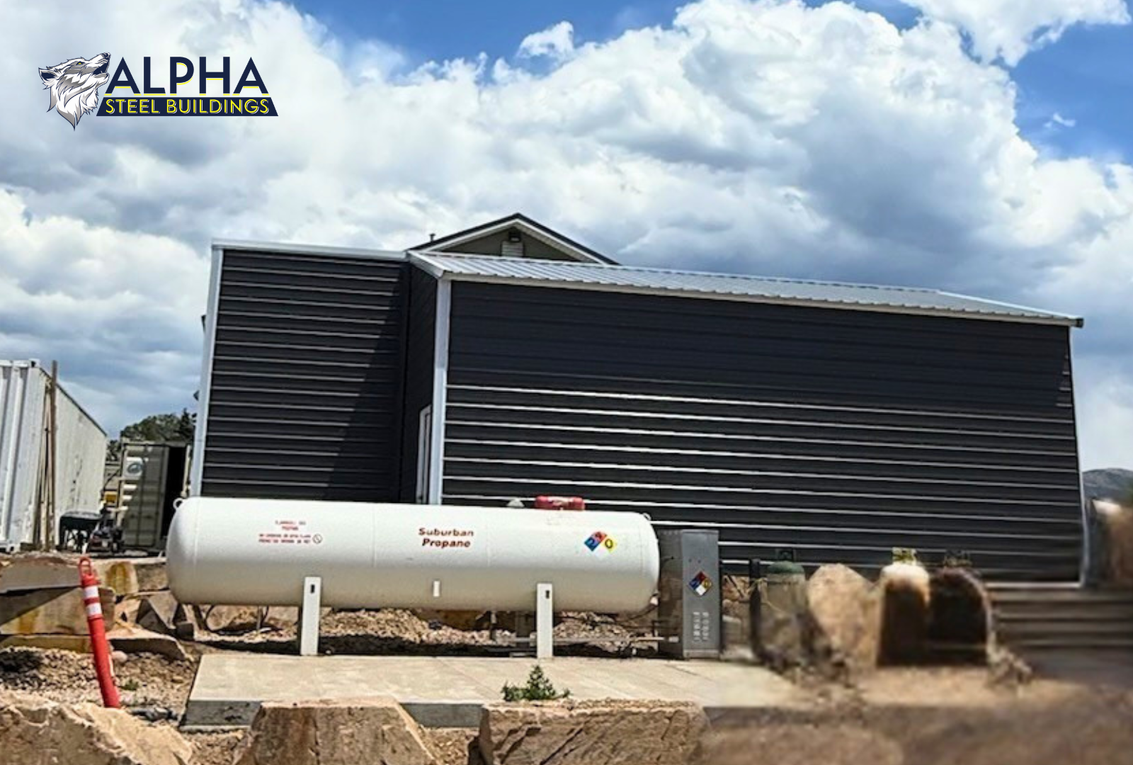 Side exterior view of a 24'x30'x12' vertical roof steel utility building with a 12'x10' attached lean-to, enclosed side walls, and vertical roof metal panels.