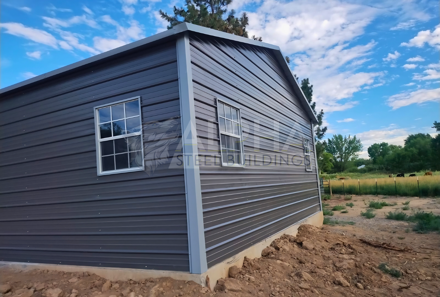 Rear right angled view of 24'x30'x9' A-frame horizontal roof garage, fully enclosed, featuring five windows, one walk-in door frame out, two overhead door frame outs on front end