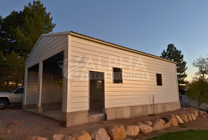 Wide front-right view of a 24x35x11 vertical roof steel garage showing overhead door, walk-in door, and window frame-outs.