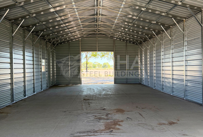 26x60x12 A-frame steel building with vertical roof, steel framing, horizontal panels and concrete floor, interior view