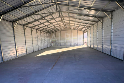 Interior view of 30' x 60' x 12' a-frame steel building with a vertical roof, fully enclosed on both sides and ends for secure storage and weather protection.