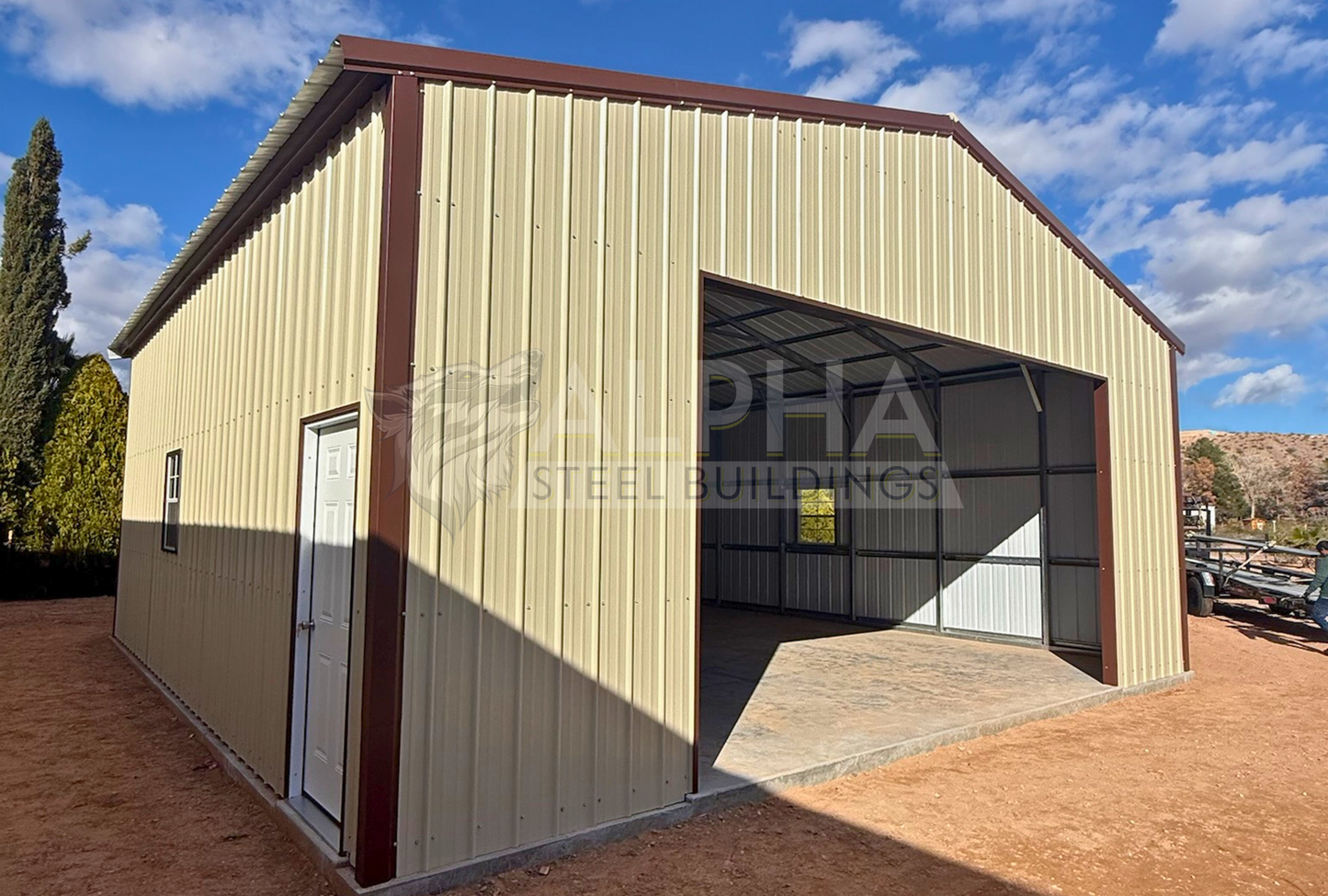 Front side view of 30x30x12 A-frame steel garage with vertical roof, 18x10 overhead door frame-out, window, and walk-in door
