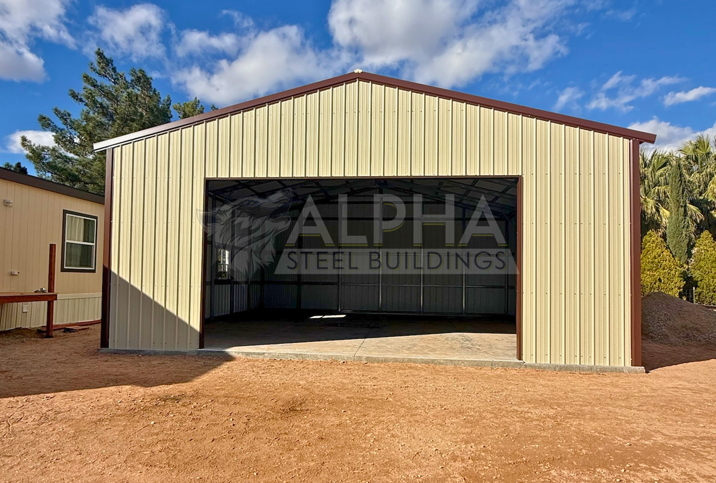 Front view of 30x30x12 A-frame steel garage with vertical roof, enclosed end wall, 18x10 overhead door frame-out, windows, and walk-in door