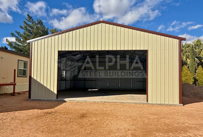 Front view of 30x30x12 A-frame steel garage with vertical roof, enclosed end wall, 18x10 overhead door frame-out, windows, and walk-in door