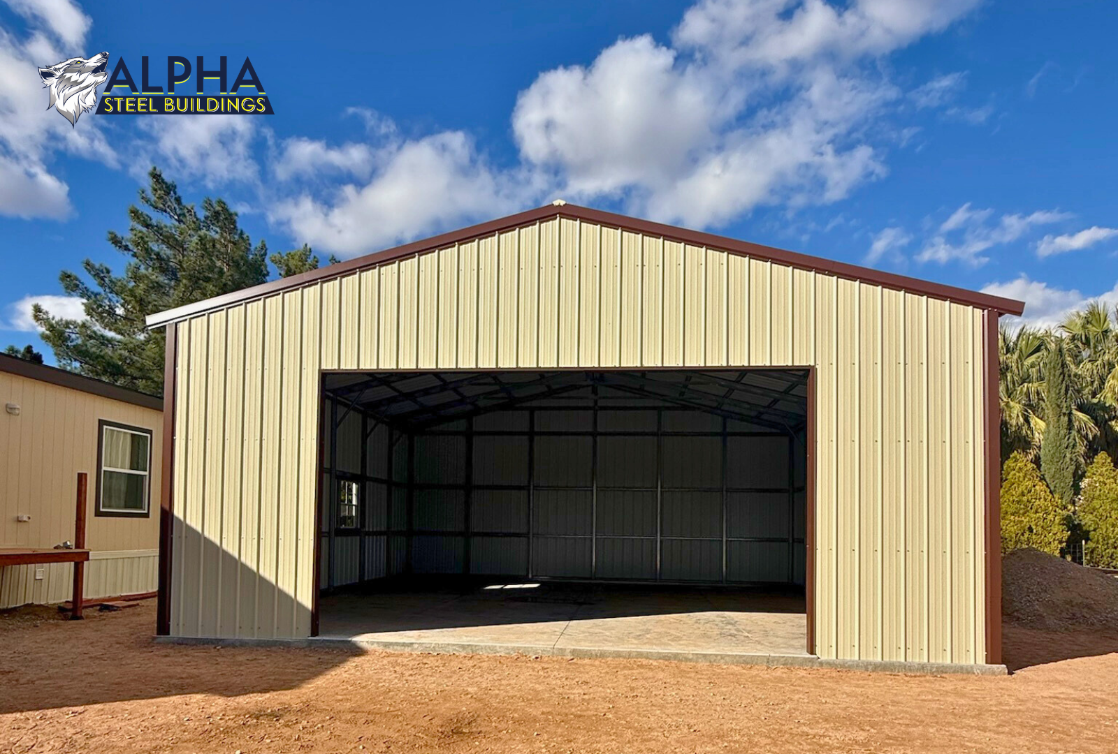 Front view of 30x30x12 A-frame steel garage with vertical roof, enclosed end wall, 18x10 overhead door frame-out, windows, and walk-in door