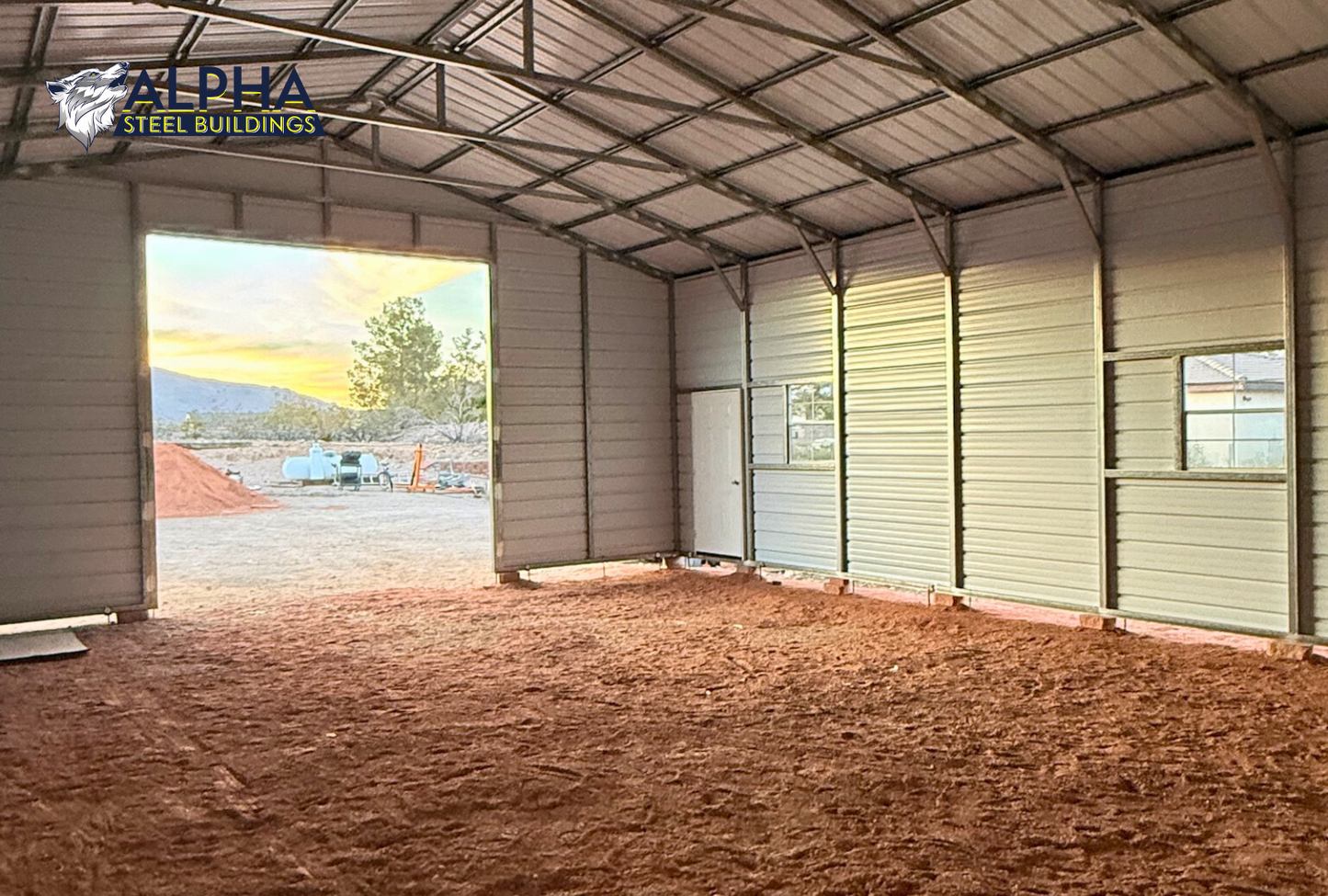 Interior angled view inside 30x40 steel garage looking toward the front wall and left side, showing structural framing and vertical roof system.