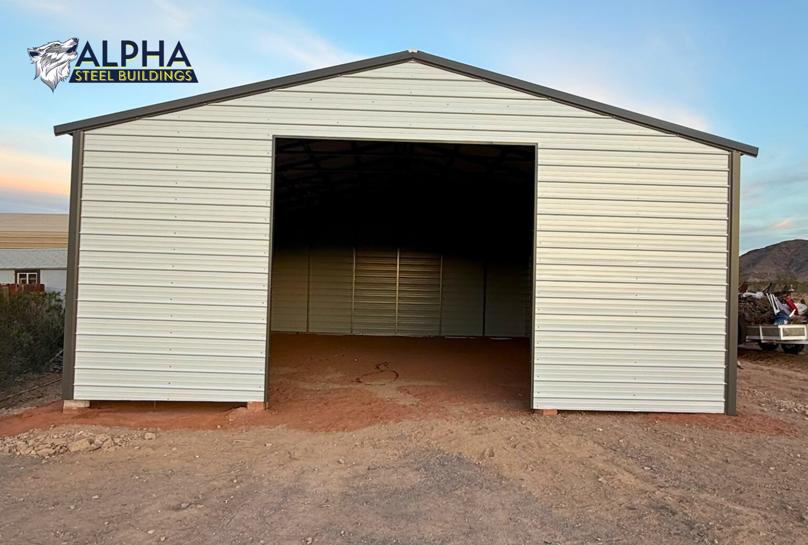 Front exterior view of 30x40 A-frame steel garage with vertical roof and framed 12x12 overhead door opening.