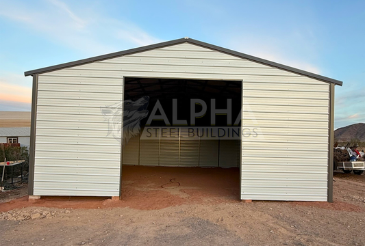 Front exterior view of 30x40 A-frame steel garage with vertical roof and framed 12x12 overhead door opening.