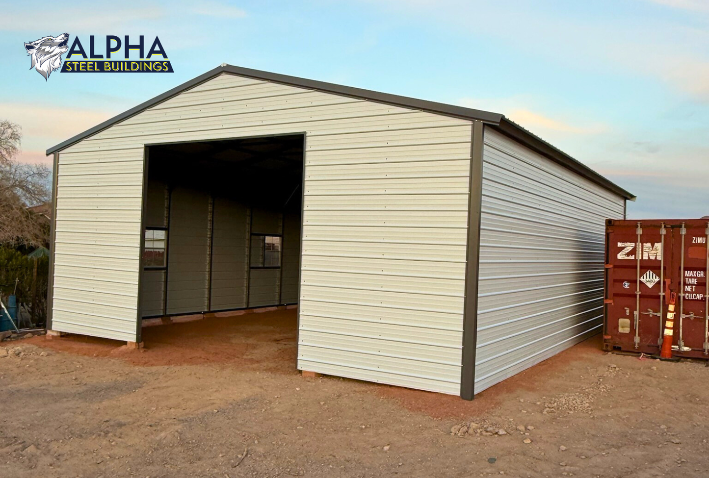 Front right angled view of 30x40 A-frame metal garage with vertical roof, fully enclosed sides, and framed overhead door opening.