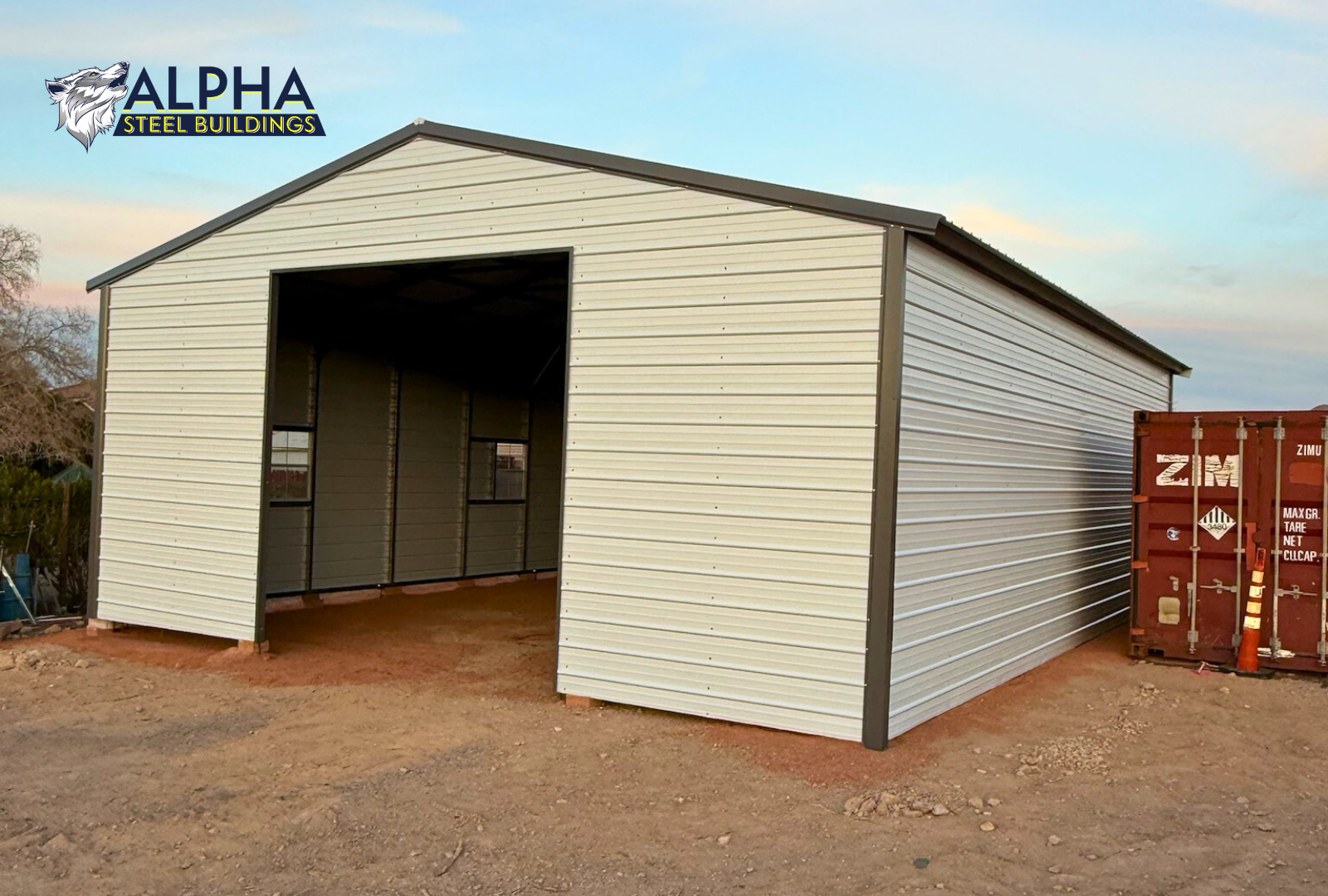 Front right angled view of 30x40 A-frame metal garage with vertical roof, fully enclosed sides, and framed overhead door opening.