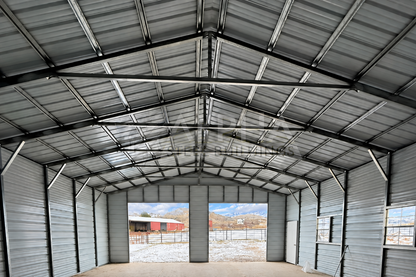 30'x40'x11' A-frame vertical roof steel shop interior front view showing steel framing and overhead door openings
