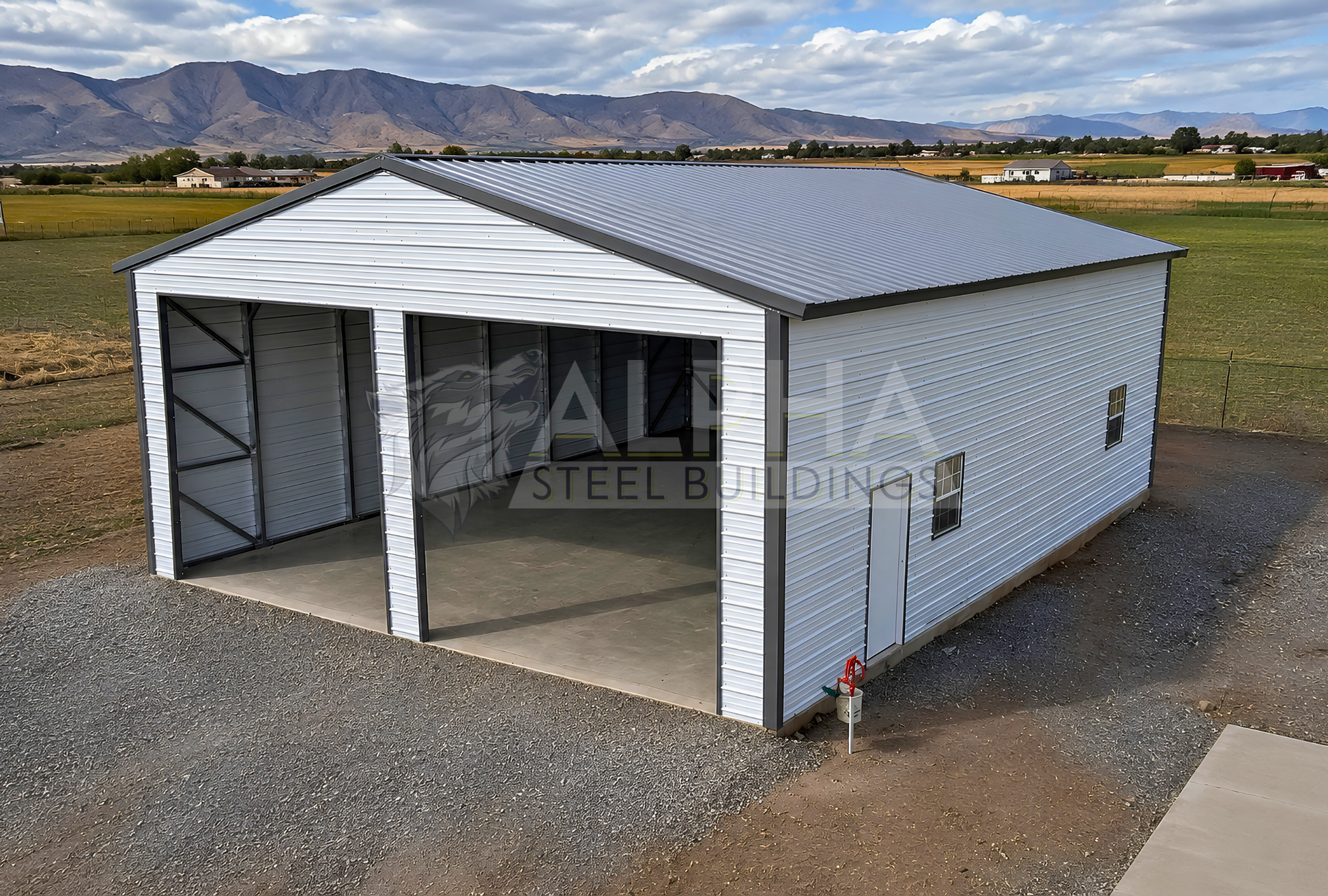 30x40x13 A-frame steel building with vertical roof, two 12x12 overhead door frame-outs, walk-in door and windows, elevated front right view