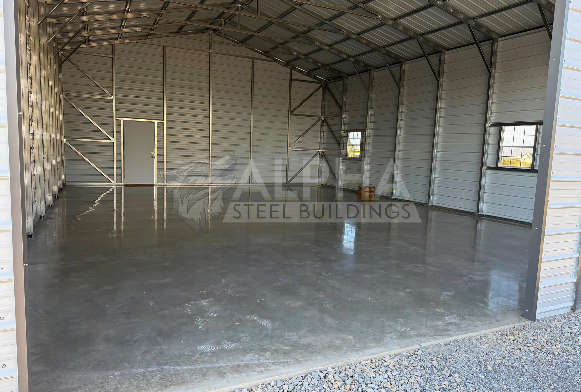 30x40x13 A-frame steel building with vertical roof, diagonal bracing and concrete floor, interior view