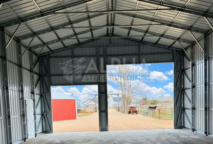 Internal front view of 30x45x16 a-frame steel shop with vertical roof, dual overhead door frame-outs, walk-in door, and closed vertical sides and ends.