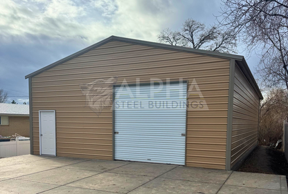 Front right angle view of enclosed 30x50 A-frame steel building with vertical roof and walk-in doors