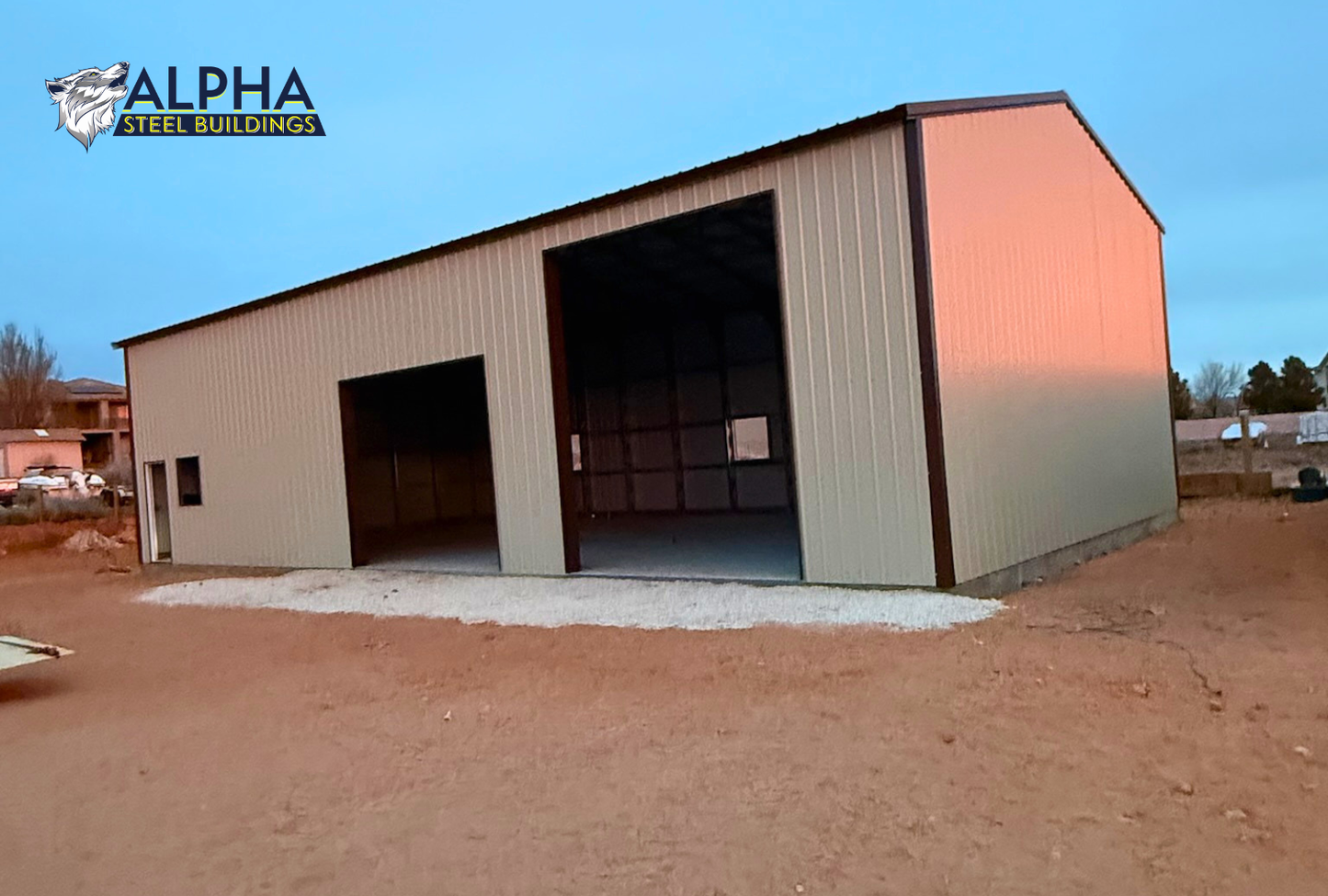 Back right angled view of 30x60x15 A-frame steel garage with vertical roof, fully enclosed walls, and multiple side wall openings.