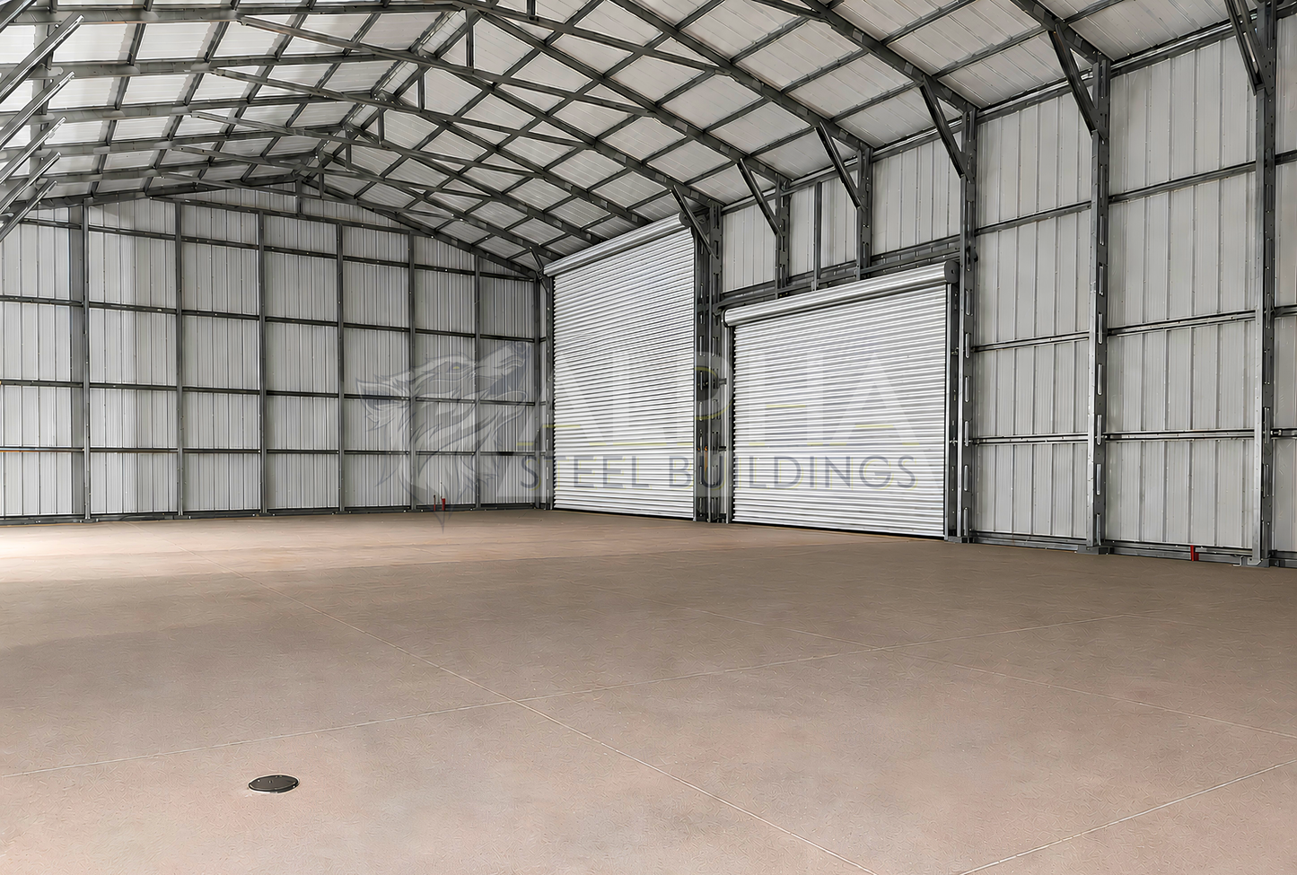 30x60x15 vertical roof steel garage interior view showing steel framing, double leg posts, and overhead doors