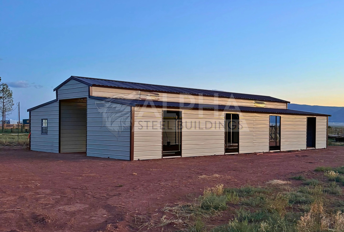 36x60x12 vertical roof steel barn with dual lean-tos and stall frame-outs, rear side view