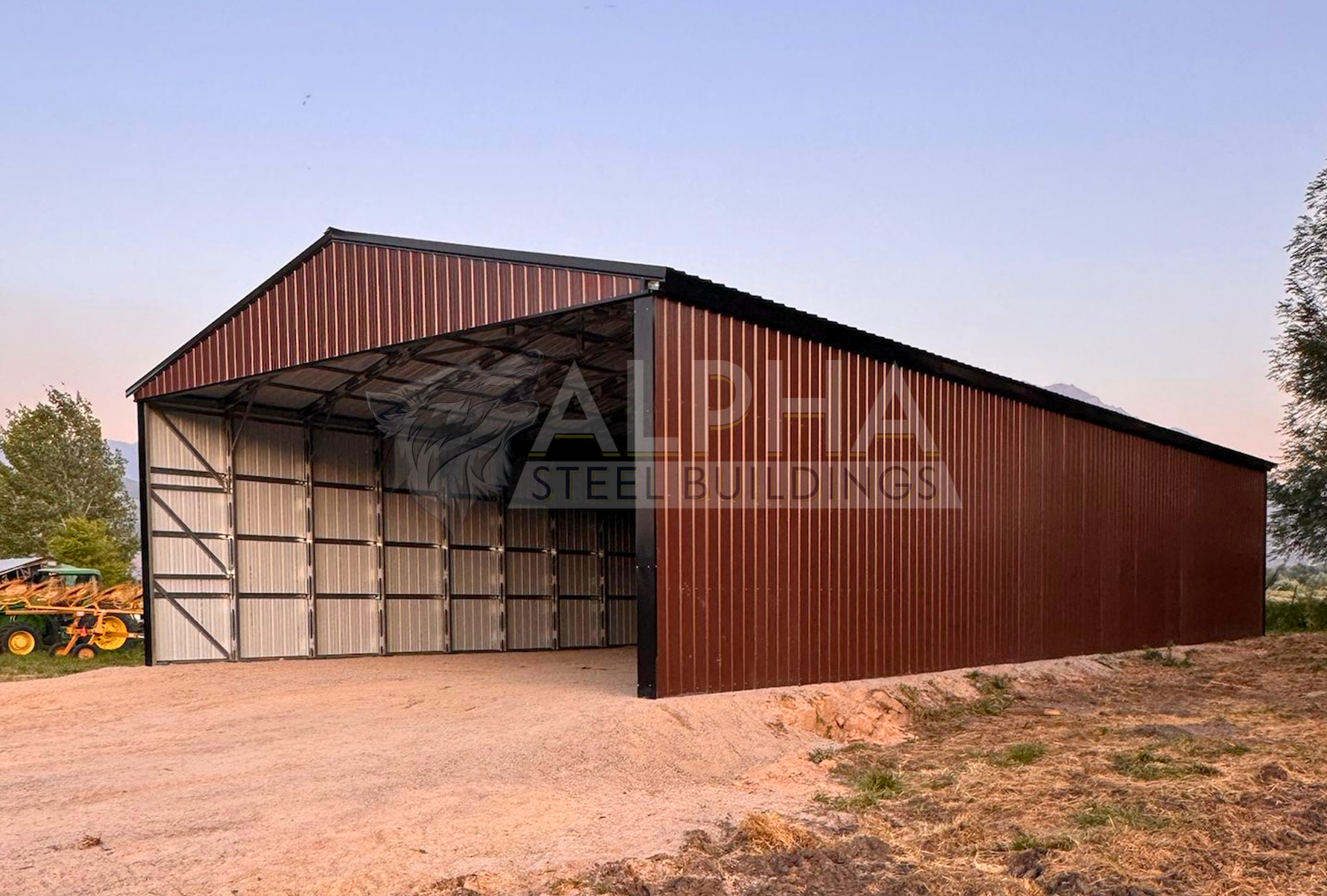 Front right angle view of a 36x80x14 ladder style A-frame steel agricultural building showing the open front, vertical roof, and fully enclosed right side.
