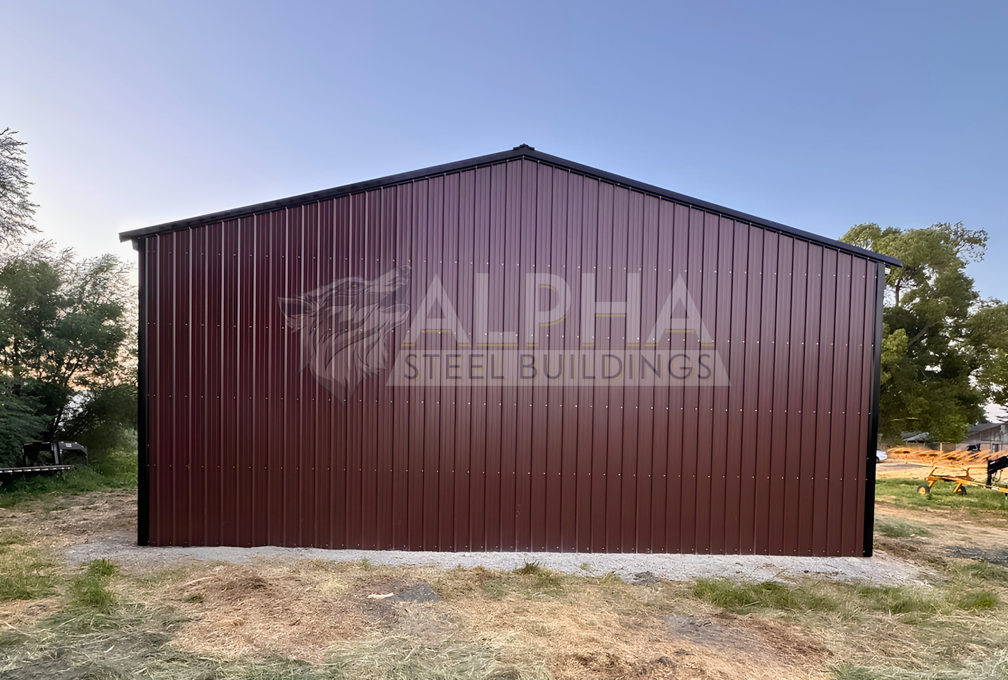 Rear view of a 36x80x14 ladder style A-frame steel agricultural building showing the fully enclosed back end with vertical metal panels.