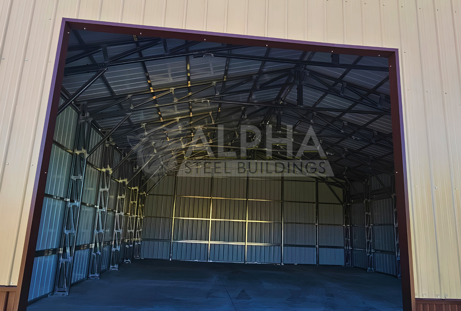 Close up front view of 56'x45'x14' clear span building with main section & dual lean-tos. Features web truss design, vertical roof, 14 Ga. frame, 40PSF ground snow load, fully enclosed with vertical siding, one walk-in door, and frame outs for one 12' x 12' overhead door and one 10' x 10' overhead doors on the front end.