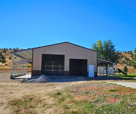 56'x45'x14' metal building with main section 36'W x 45'L x 14'H, left lean-to 10'W x 45'L x 14'-11'6"H, right lean-to 10'W x 45'L x 10'-7'6"H. Features web truss design, vertical roof, 14 Ga. frame, 40PSF ground snow load, fully enclosed with vertical siding, one 36" x 80" walk-in door, and frame outs for one 12' x 12' and one 10' x 10' overhead doors on the front end. Includes 150 1/2" concrete bolts.