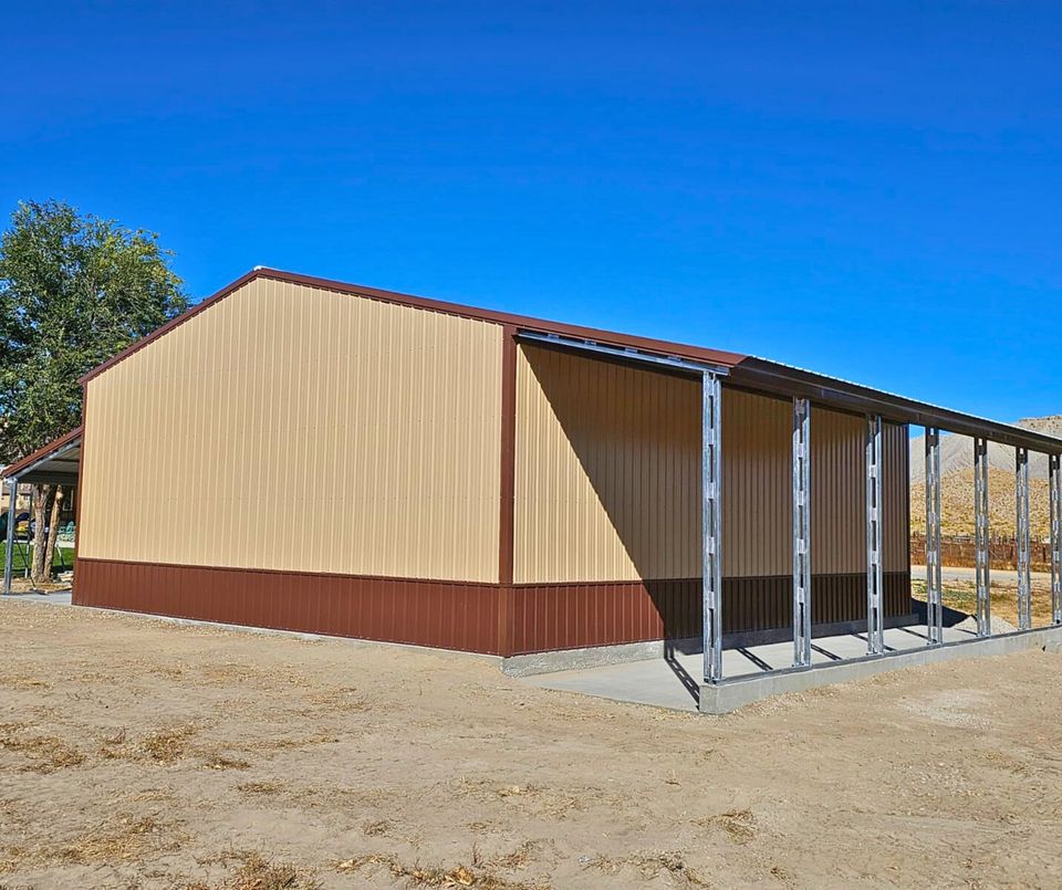 56'x45'x14' metal building with main section 36'W x 45'L x 14'H, left lean-to 10'W x 45'L x 14'-11'6"H, right lean-to 10'W x 45'L x 10'-7'6"H. Features web truss design, vertical roof, 14 Ga. frame, 40PSF ground snow load, fully enclosed with vertical siding, one 36" x 80" walk-in door, and frame outs for one 12' x 12' and one 10' x 10' overhead doors on the front end. Includes 150 1/2" concrete bolts.