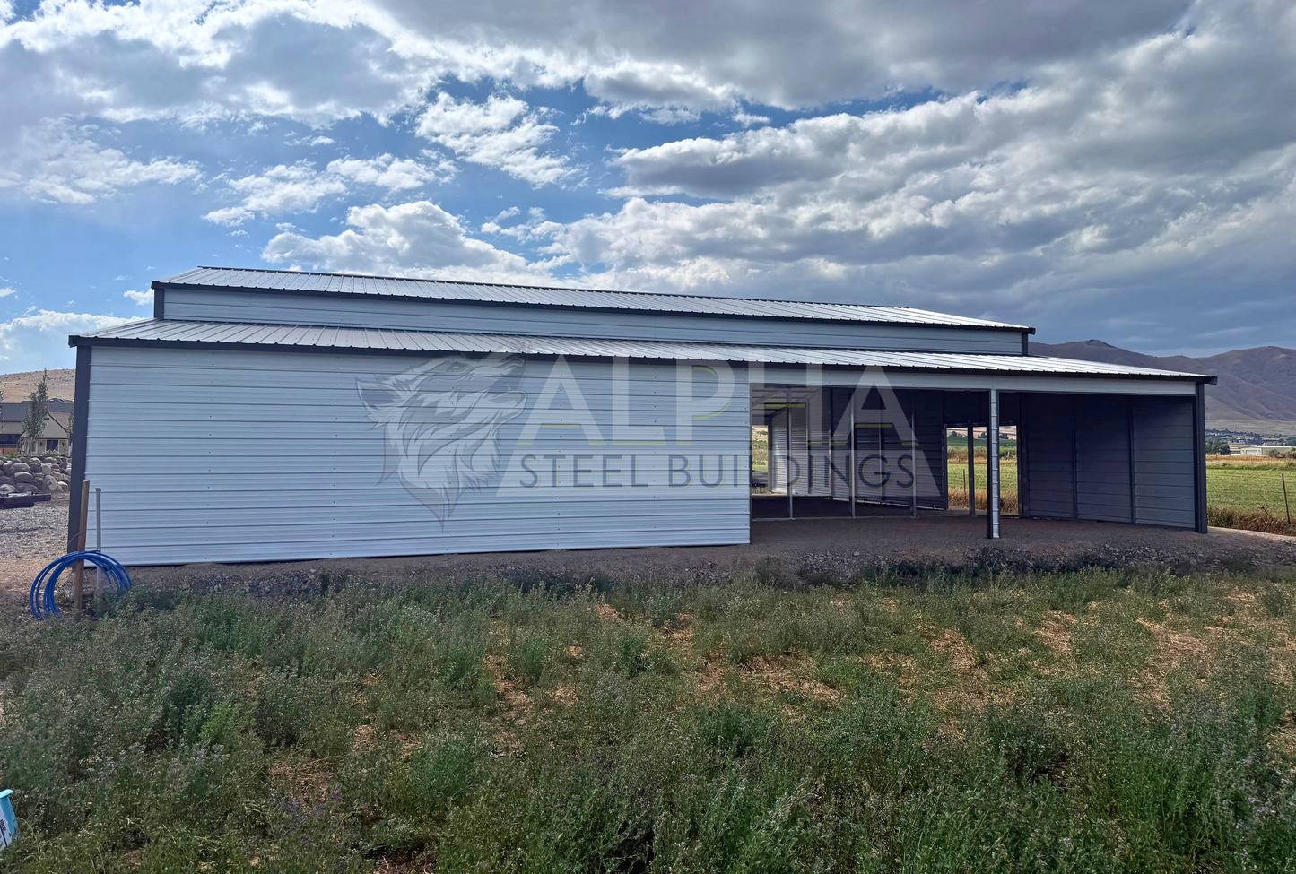 60x60x14 vertical roof steel barn with dual lean-tos and stall frame-outs, right side view