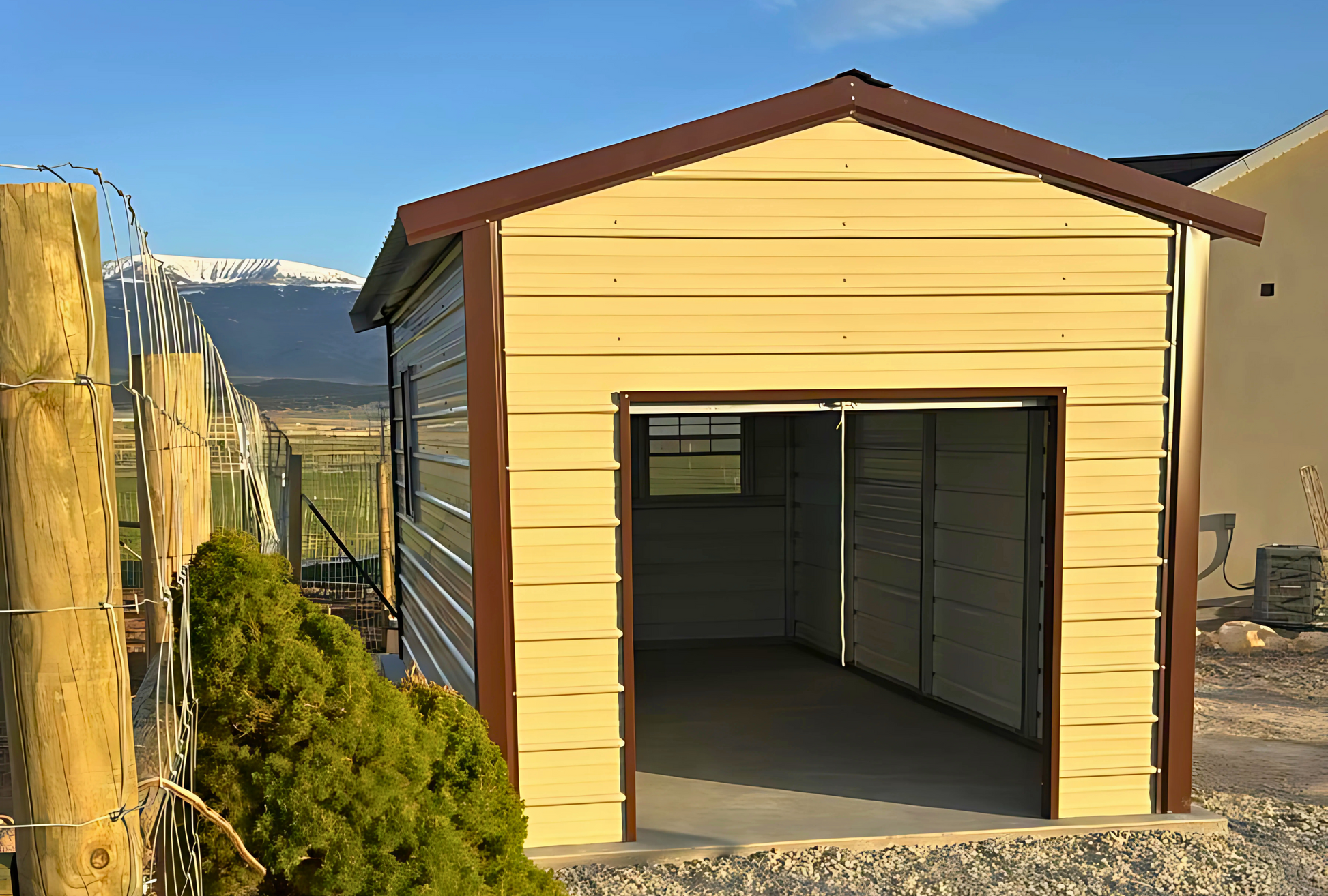 10'x20'x8' a-frame style vertical roof, heavy duty to withstand the snow, closed on both sides and the ends, with one walk in door, two windows & one 6' x 6' roll-up door.