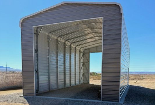 20x40 Regular Style steel building with 14-foot height, horizontal roof, closed horizontal sides and ends, two 14x14 overhead door frame-outs, 36x80 walk-in door, engineered for 30 PSF ground snow load, front angled view.