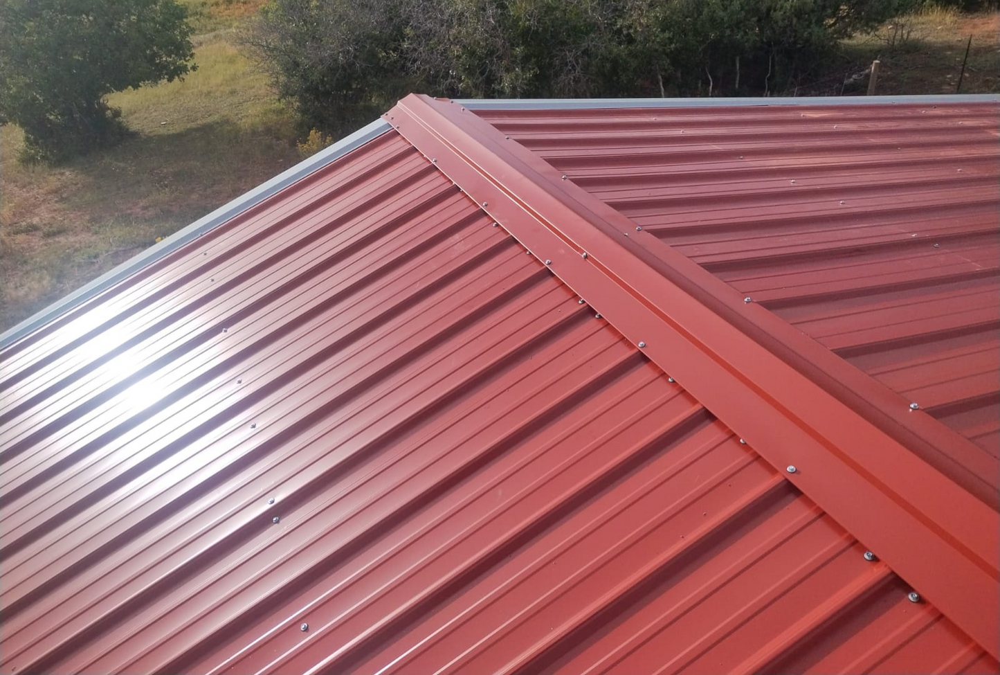 Overhead view of 30x40 A-frame metal shelter with vertical roof for superior water runoff