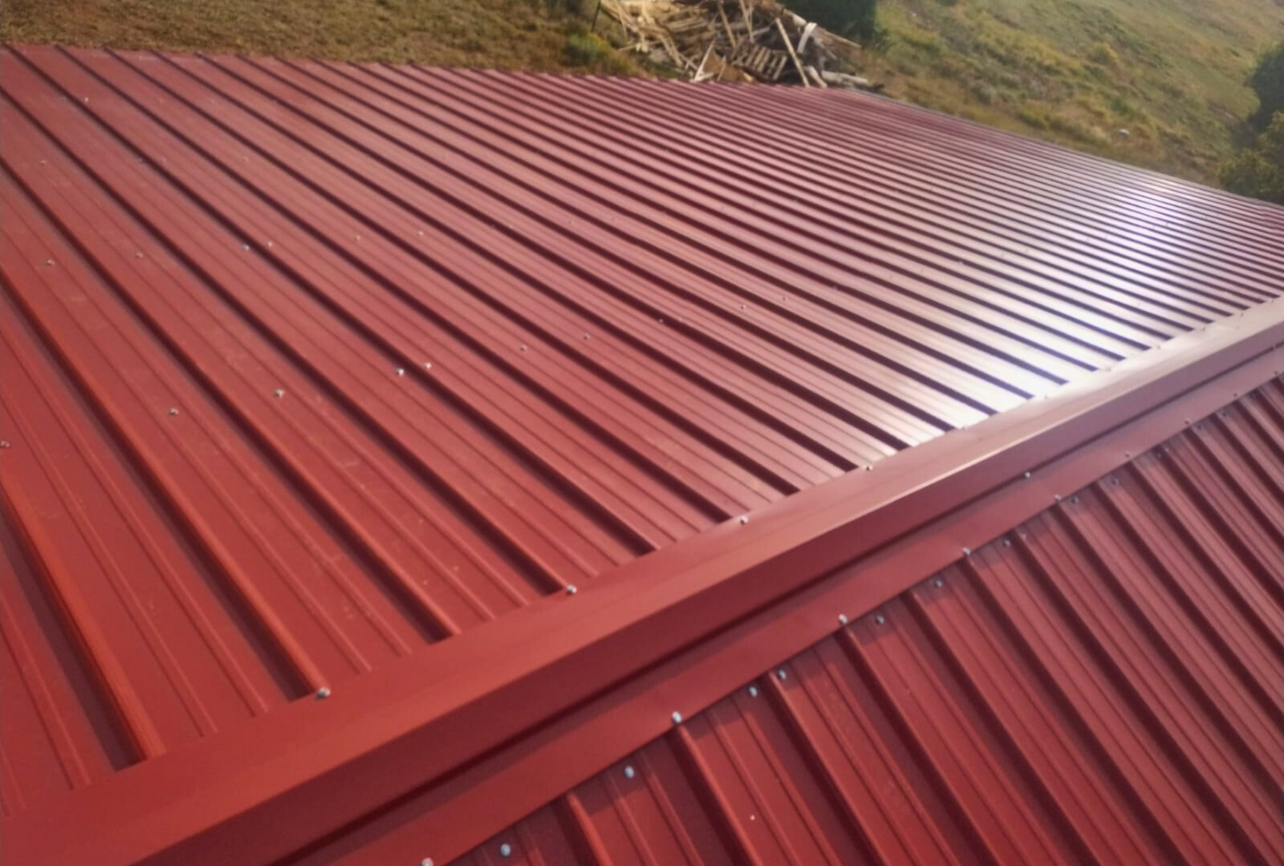 Overhead view of 30x40 A-frame metal shelter with vertical roof for superior water runoff