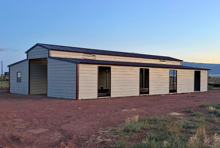 36'x60'x12' down to 10'-8' steel barn style with lean-tos, two panels under the eave, both sides closed, all ends closed, with 12' x 10' tack room, (2) 10' x 10' frame outs on the ends, (1) 10' x 10' frame out on the side of main, (4) 4' x 7' stall frame outs, (2) 30" x 36" windows, (2) 36" x 80" walk-in doors, right side view.