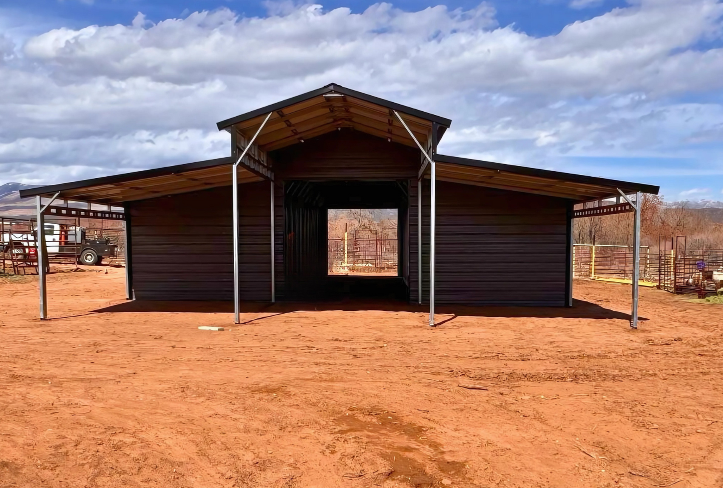 36'x80'x12' down to 10'-8' steel barn with lean-tos, two panels under the eave, both sides closed @ 60'L, all ends closed & front porch, front view.