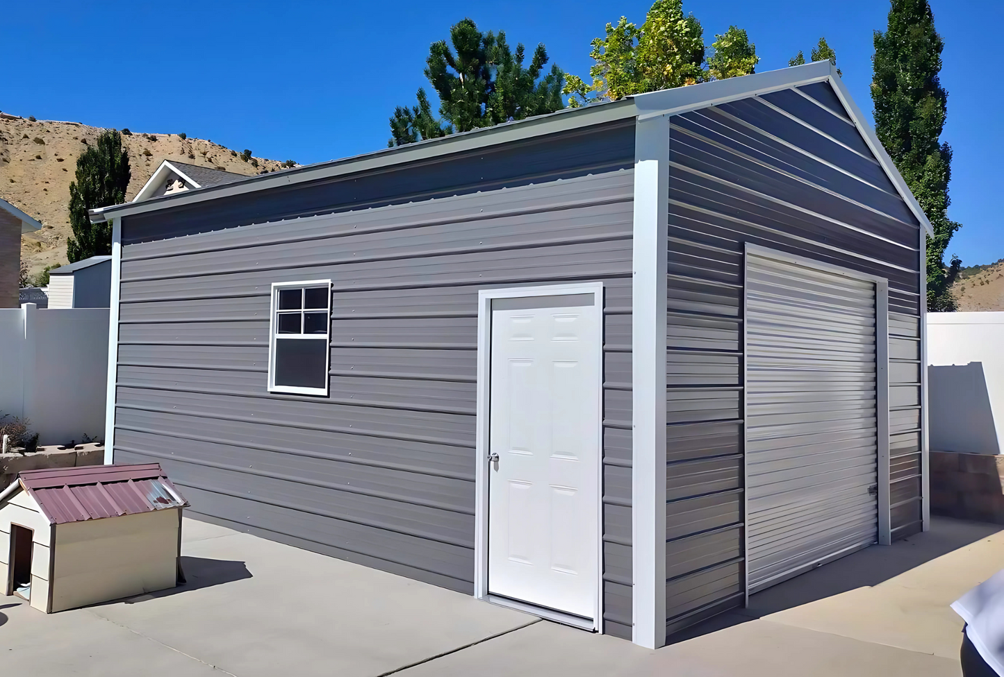 Front left view 18'x25'x10' f-frame vertical roof building with roll-up door, walk-in door, and window.