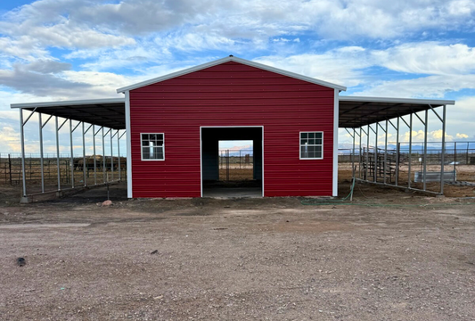 Front view of a 48x40 metal barn by Alpha Steel Buildings featuring dual 12-foot lean-tos, vertical roof, two 7x8 overhead door frame-outs on each end, and 4x8 sliding doors on both sides.